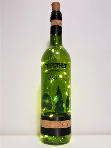 Bottle light with trees and "together we make a family"