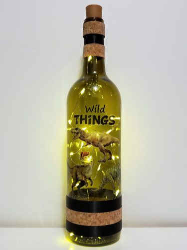 Bottle light with three dinosaurs and "Wild Things".