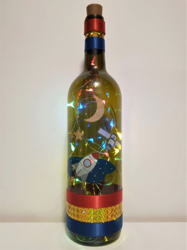 Bottle light for kids with satellite, rocketship and moon.