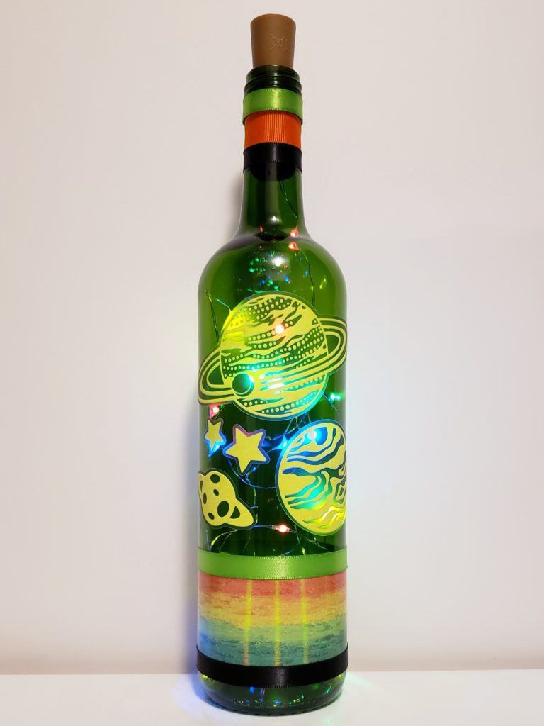 Bottle light with glow in the dark planets.