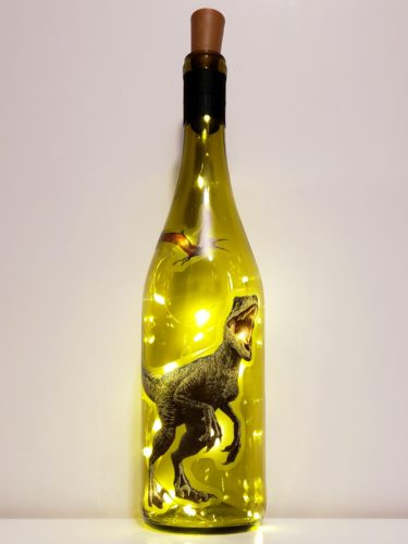 Bottle light with t-rex and flying dinosaur from Jurassic Park.