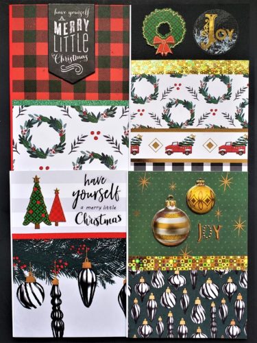 Four pack of Christmas cards with wreaths and ornaments in red, green, grey, black and gold.