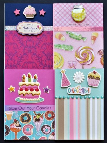 Four pack of birthday cards with cupcakes, donuts and sweets.