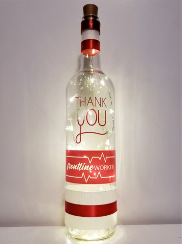 Bottle light with a stethoscope within "Thank You", a heart monitor rhythm with "Frontline Worker".