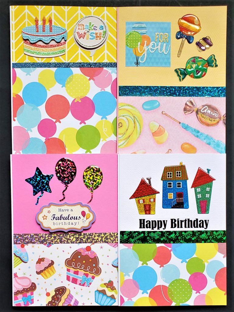 Four pack of birthday cards with balloon, candy and cupcake prints.
