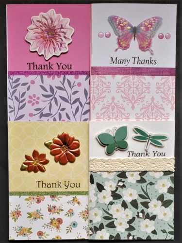 Four pack of thank you cards with three floral prints and one damask print.