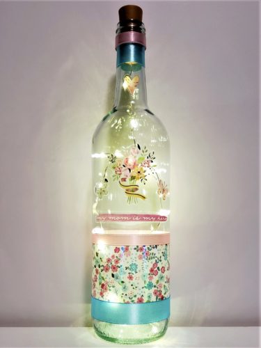 Bottle light with "My mom is my hero" below a pastel bouquet.