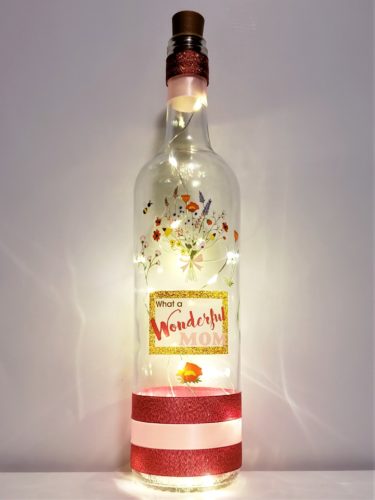 Bottle light with a wildflower bouquet and the phrase, "What a wonderful mom".