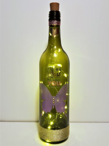 Bottle light with a large, glittery butterfly and the phrase, "I'd be lost without you."