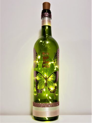 Bottle light with pink metallic butterflies and "You are the best".