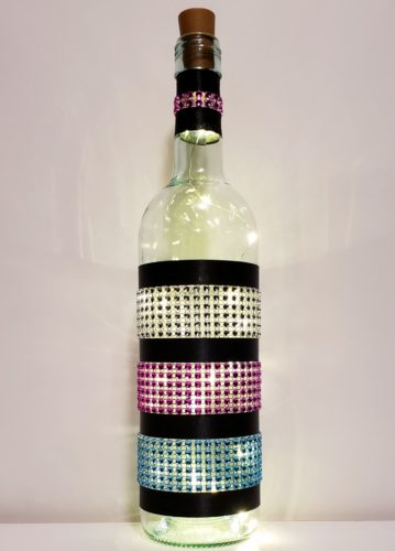 Bottle light with three sections of jewel wraps.