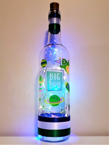 Bottle light with space monsters and the words, "Big Bro."
