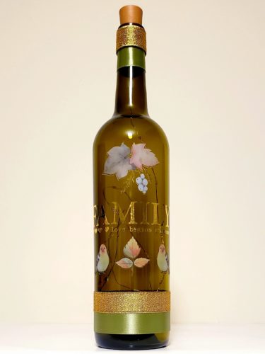 Bottle light with "Family: Love begins at home" surrounded by fall foliage and birds.