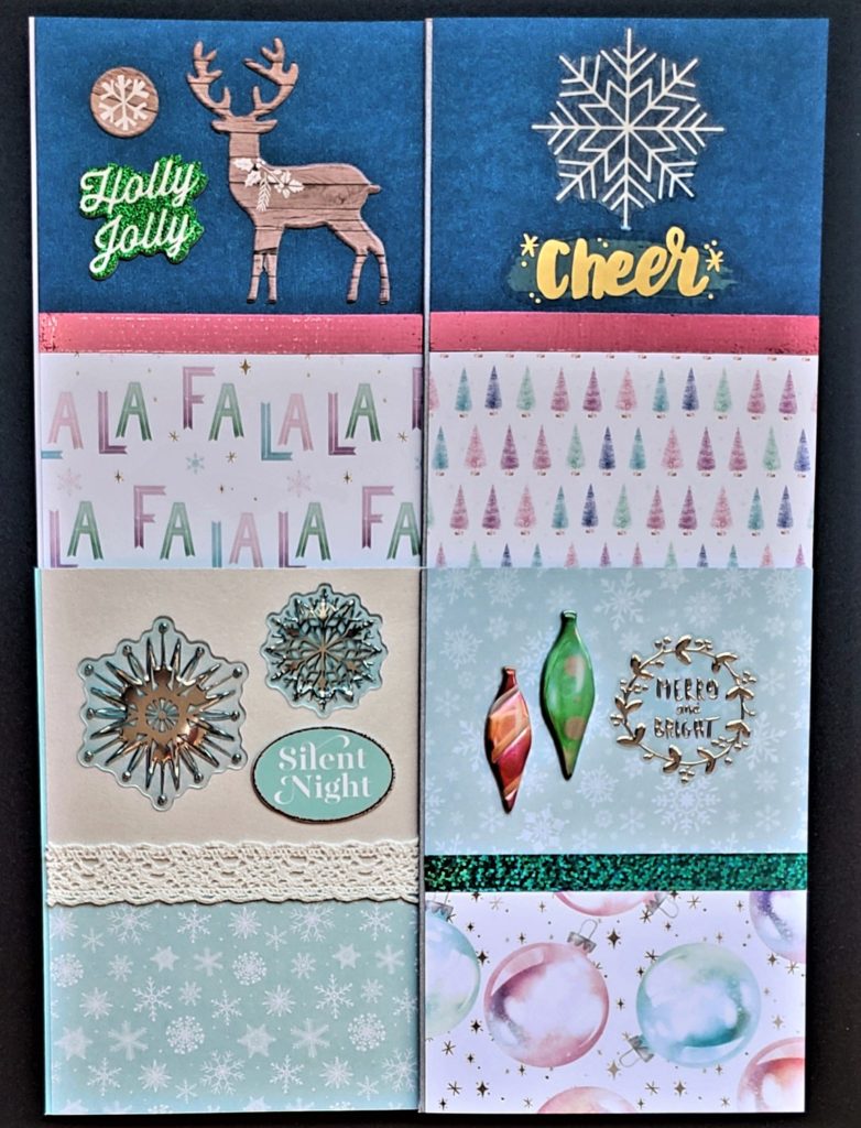Four pack of Christmas cards in the sugarplum prints, featuring ornaments, trees, snowflakes and "Fa la la la la".