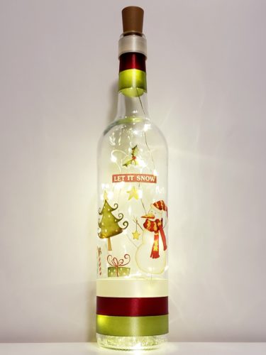 Bottle light featuring "Let it snow", a snowman, tree, and present.