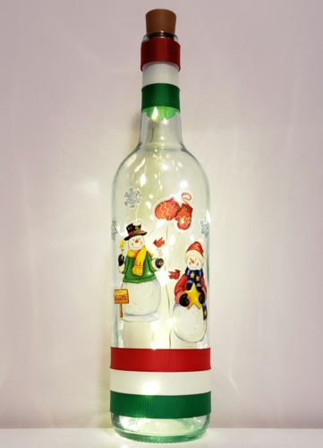 Bottle light featuring two snowmen, mittens and snowrflakes.