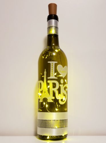 Bottle light featuring the phrase, "I love Paris", with an etched-style finish.