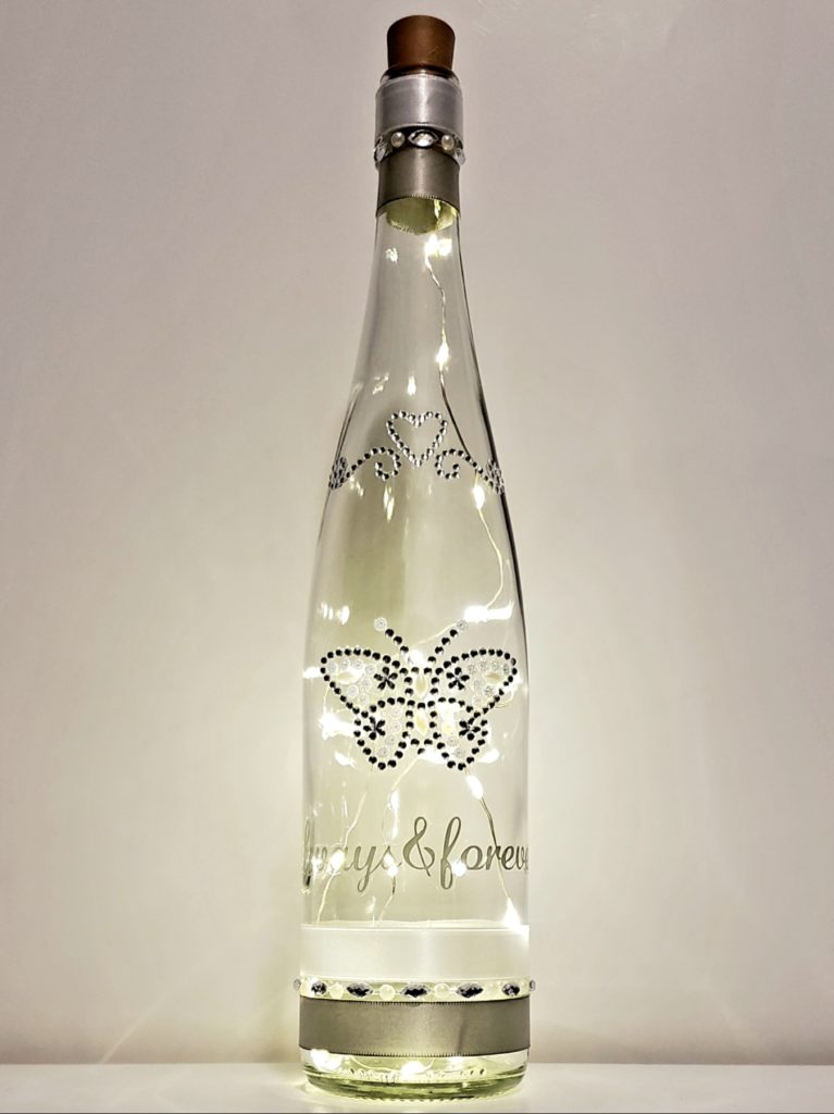 Bottle light featuring a jeweled butterfly and heart accent, and the phrase, "Always & Forever".