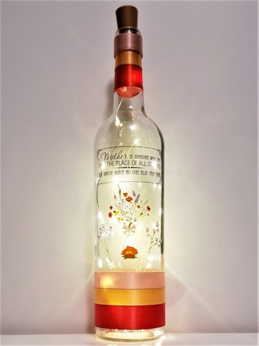 Bottle light featuring a wildflower bouquet and the phrase, "A mother is someone who can take the place of all others but whose place no one else can take".