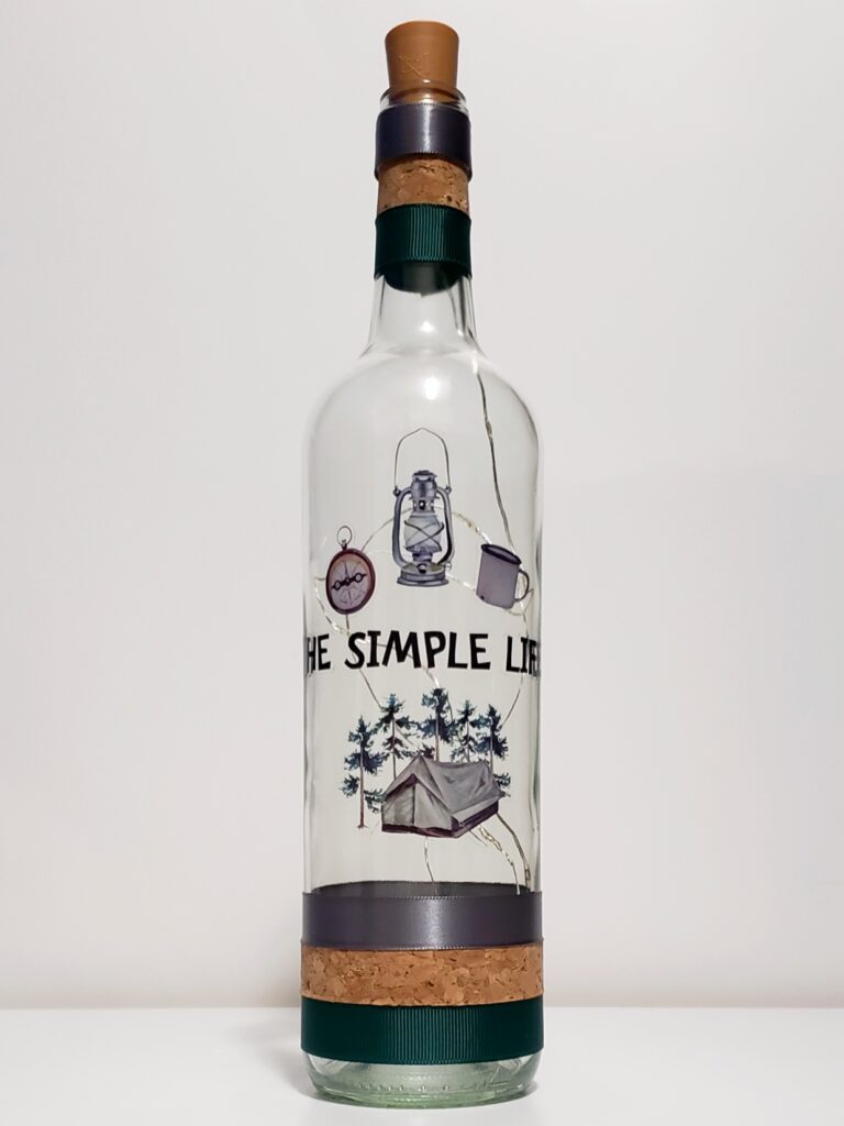 Bottle light with a tent, forest, and camping paraphernalia.