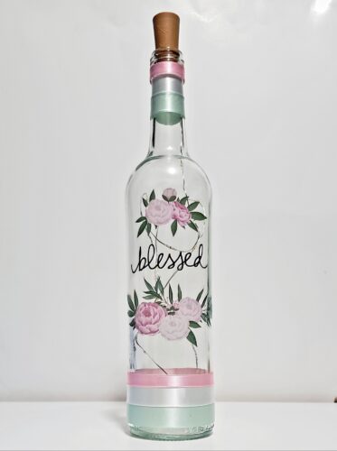 Bottle light with pink flowers and the word, "Blessed".